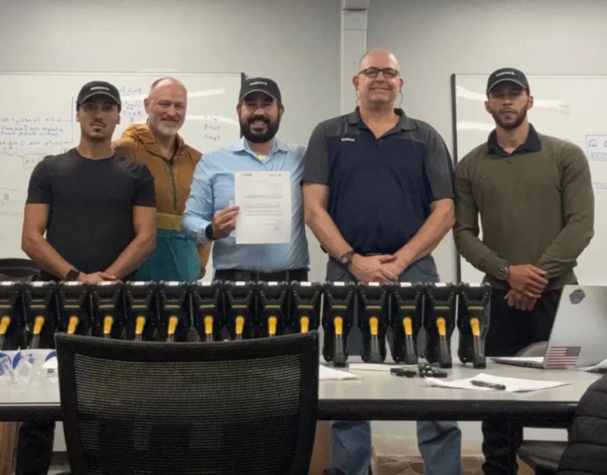 CPCON field team with rows of handheld barcode scanners prepared for an inventory project